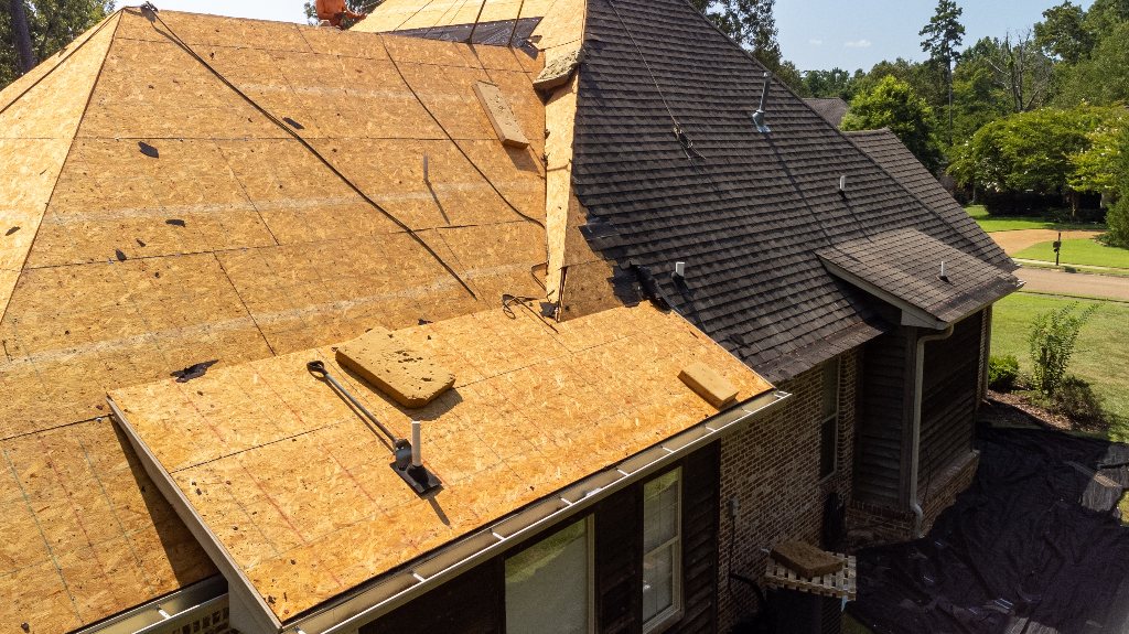 House with new roof being installed